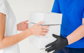 close up courier delivering boxes