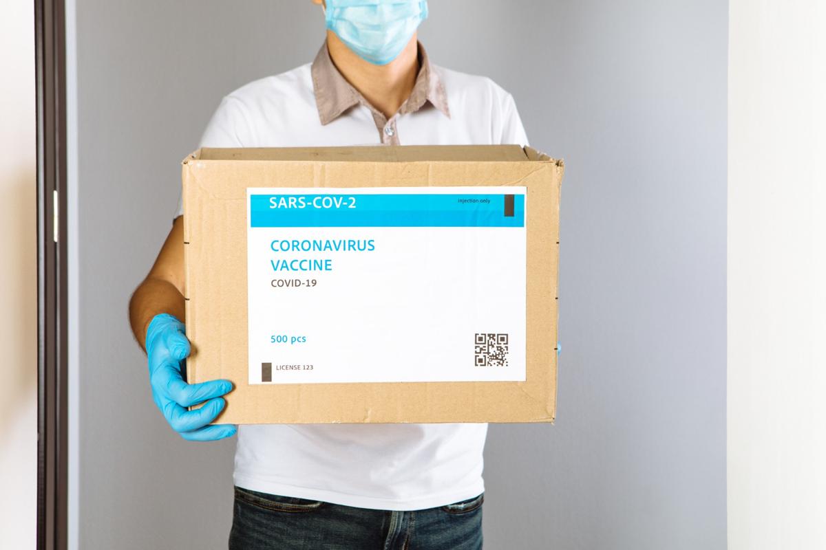 Delivery medical box of vaccines. The courier delivers the vaccine. Delivery medical box of vaccines. The courier delivers the vaccine.